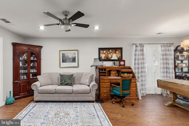 home office featuring wood-type flooring and ceiling fan