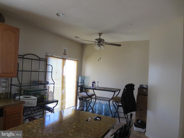 dining space featuring ceiling fan