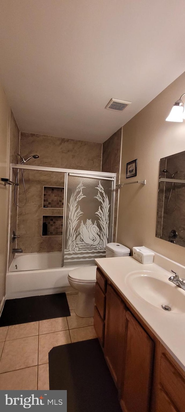 full bath with visible vents, toilet, tile patterned flooring, tub / shower combination, and vanity