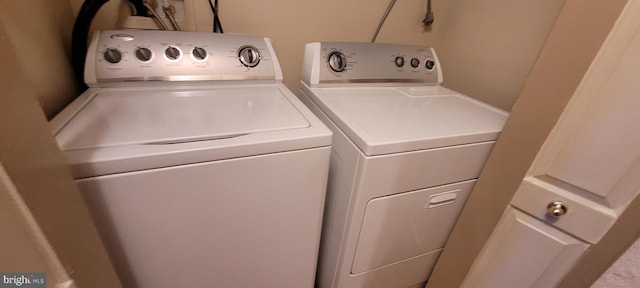 clothes washing area featuring laundry area and independent washer and dryer