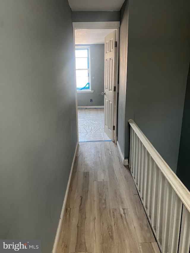 hallway with light wood-type flooring