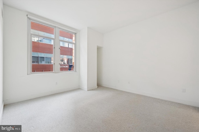 unfurnished room with carpet floors