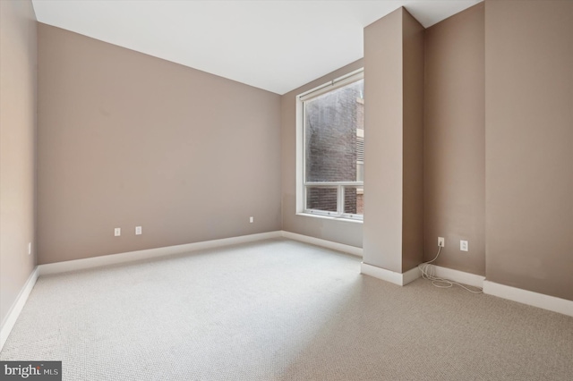 empty room with light colored carpet