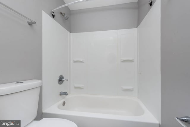 bathroom featuring toilet and shower / bath combination