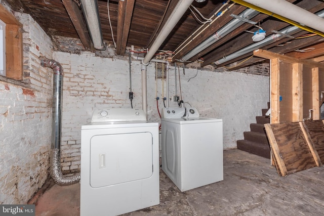 basement with washing machine and clothes dryer