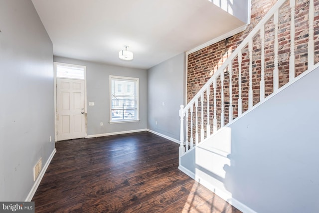 entrance foyer with dark hardwood / wood-style flooring