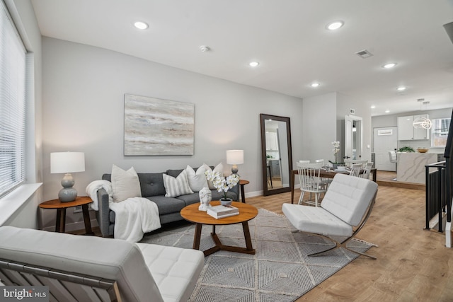 living room with light hardwood / wood-style floors