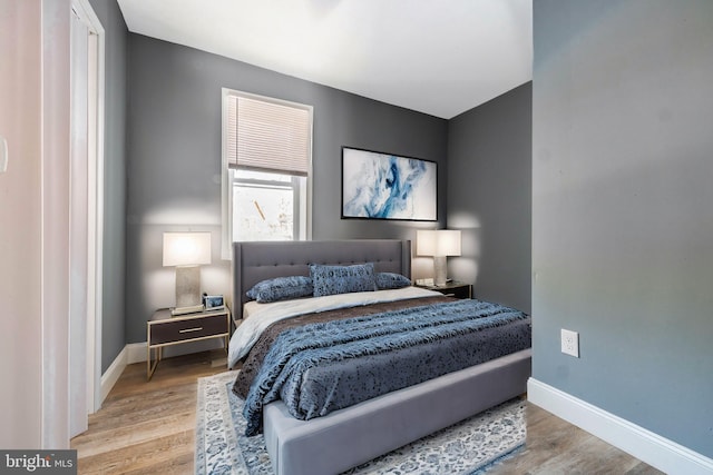 bedroom with light hardwood / wood-style floors