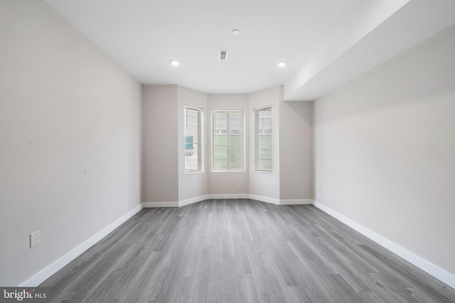 empty room with wood-type flooring