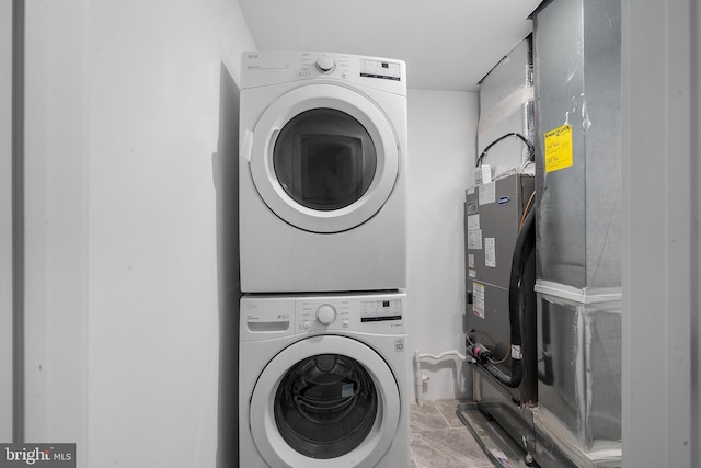 washroom with stacked washer and dryer