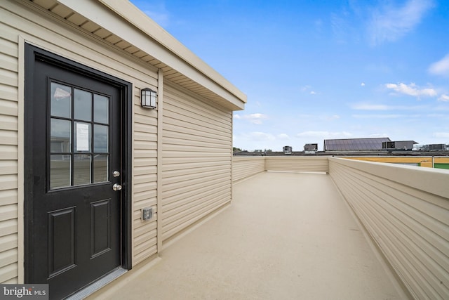 entrance to property featuring a balcony