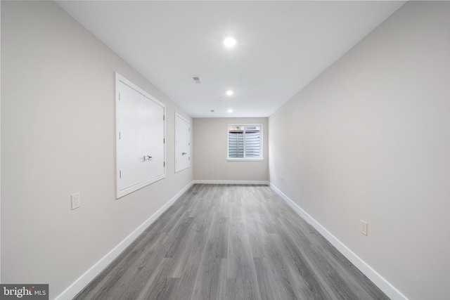 unfurnished room featuring hardwood / wood-style flooring