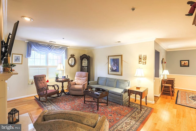 living room with crown molding and light hardwood / wood-style flooring