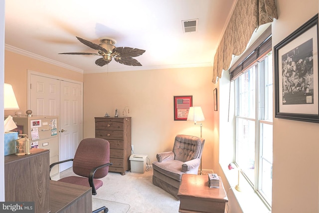 office space with ceiling fan, ornamental molding, and light carpet