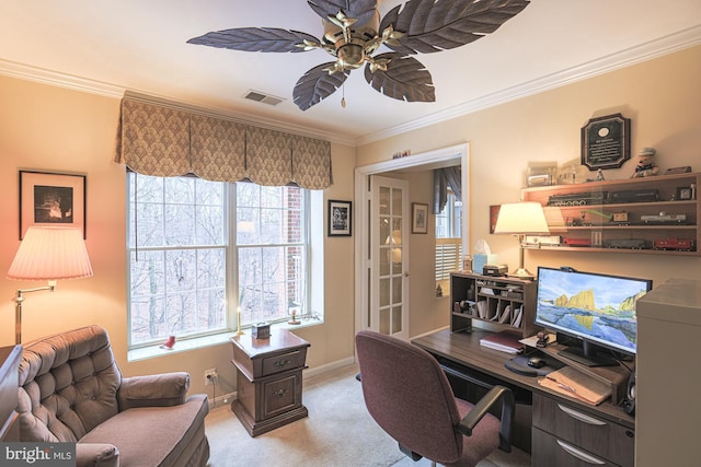 home office with crown molding, light carpet, and ceiling fan