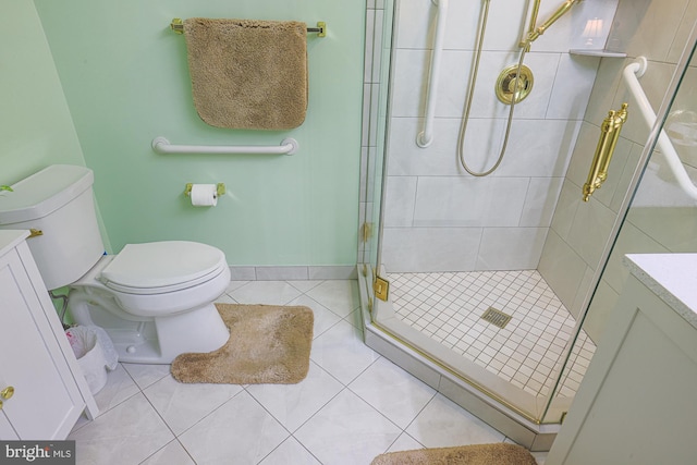 bathroom with walk in shower, vanity, tile patterned floors, and toilet