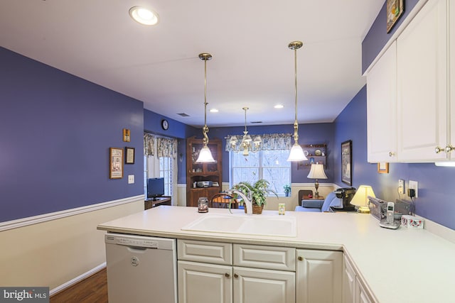 kitchen featuring sink, hanging light fixtures, kitchen peninsula, dishwasher, and white cabinets