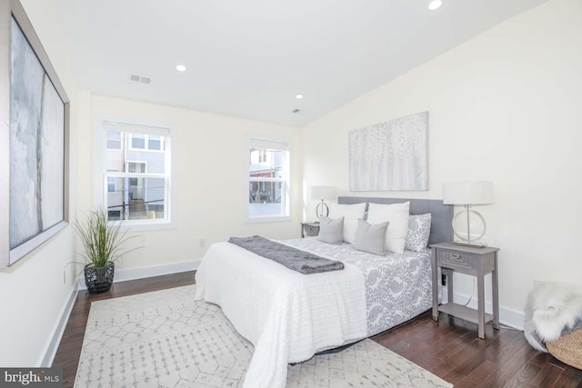 bedroom featuring vaulted ceiling and dark hardwood / wood-style flooring