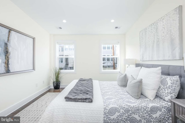 bedroom with wood-type flooring