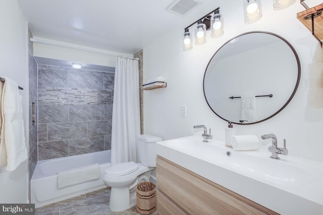 full bathroom featuring vanity, tile patterned flooring, toilet, and shower / bath combo