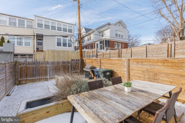 wooden deck with a grill