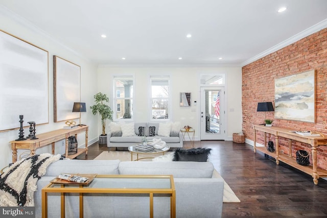 living room featuring crown molding, brick wall, and dark hardwood / wood-style floors