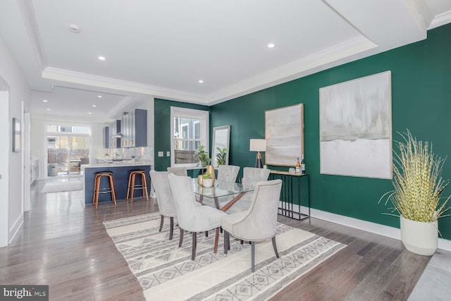 dining room featuring crown molding and hardwood / wood-style floors