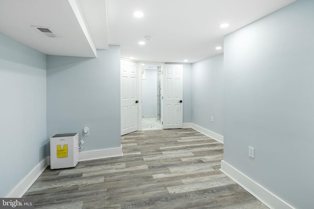 basement featuring light hardwood / wood-style floors