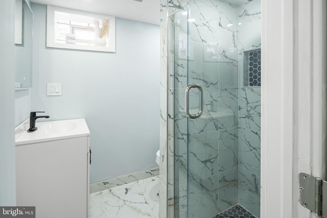 bathroom featuring vanity, an enclosed shower, and toilet