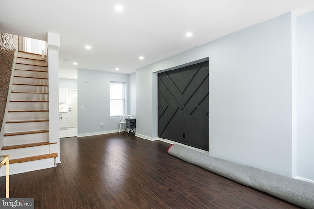 foyer entrance featuring dark wood-type flooring