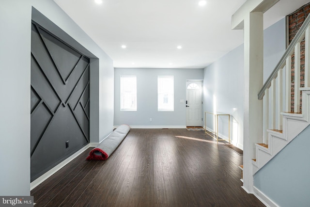 entryway with dark wood-type flooring