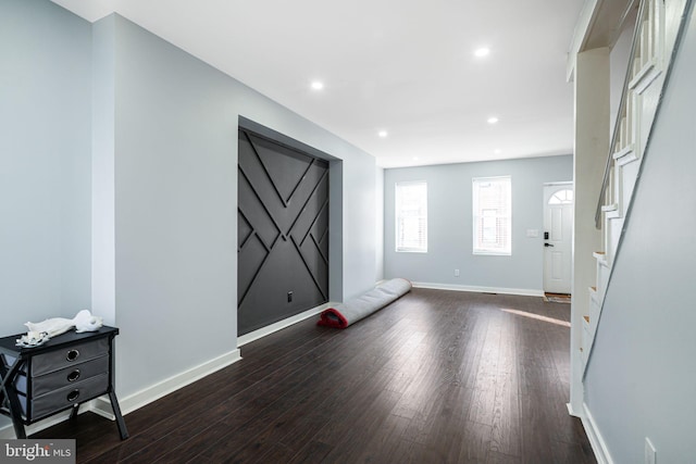 foyer entrance featuring dark hardwood / wood-style flooring