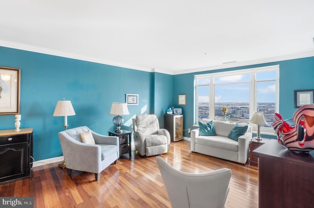 living room with ornamental molding and hardwood / wood-style floors