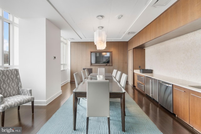 dining area with dark wood-type flooring