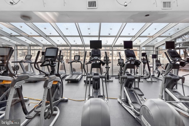 workout area featuring floor to ceiling windows