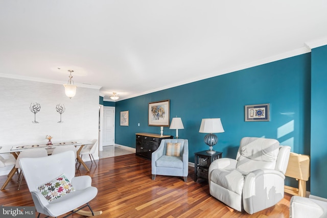 living room featuring crown molding and hardwood / wood-style floors