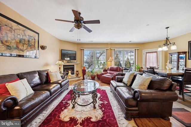 living room featuring hardwood / wood-style flooring and ceiling fan