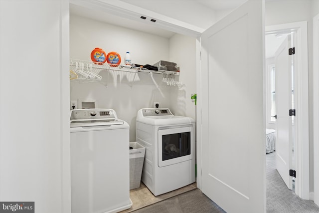 laundry area featuring independent washer and dryer