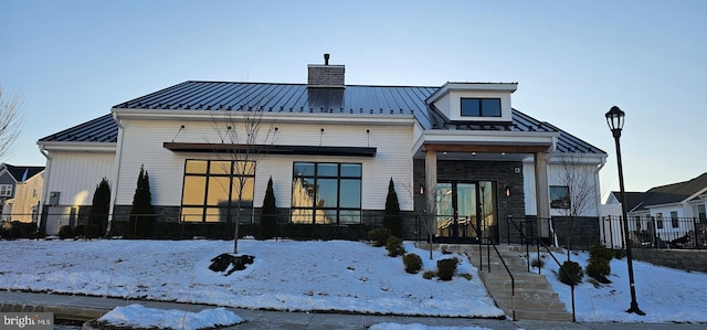 view of snow covered house