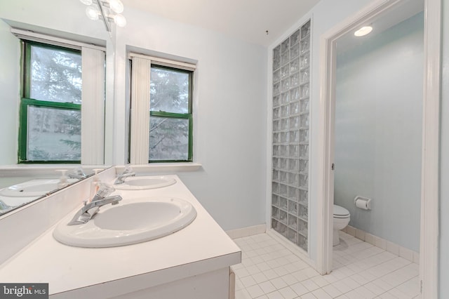 bathroom with vanity, tile patterned floors, and toilet