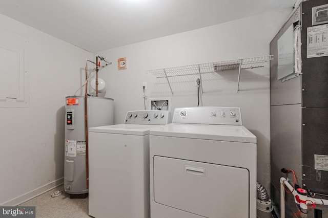 clothes washing area with water heater, heating unit, and independent washer and dryer