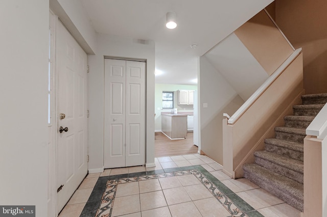 entrance foyer with light tile patterned floors