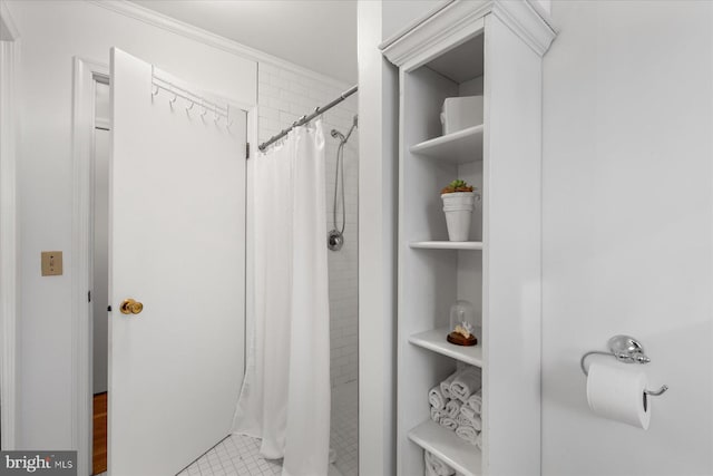 bathroom featuring tile patterned flooring and a shower with shower curtain