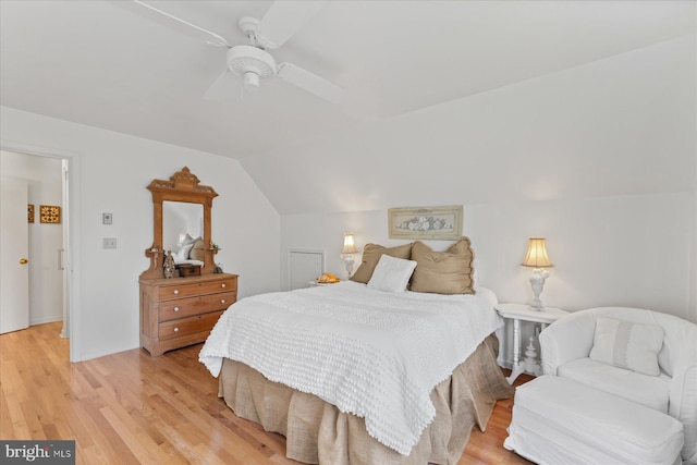 bedroom with lofted ceiling, light wood-type flooring, and ceiling fan