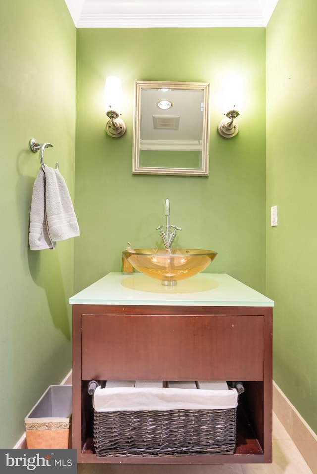 bathroom featuring sink and ornamental molding