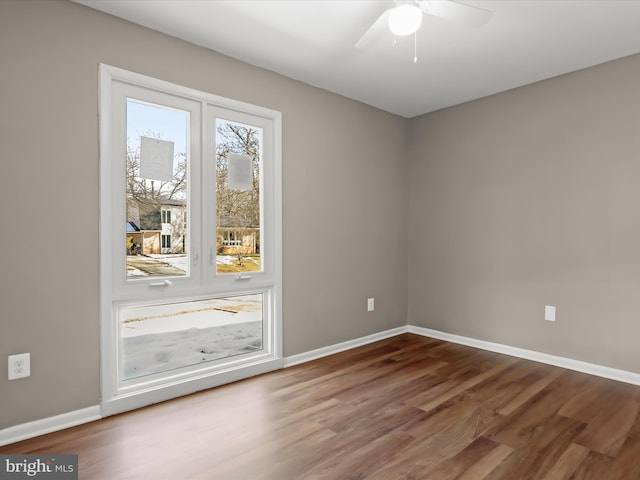 unfurnished room featuring hardwood / wood-style flooring and ceiling fan