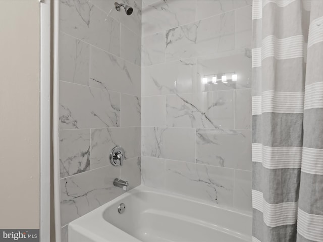 bathroom featuring shower / tub combo with curtain