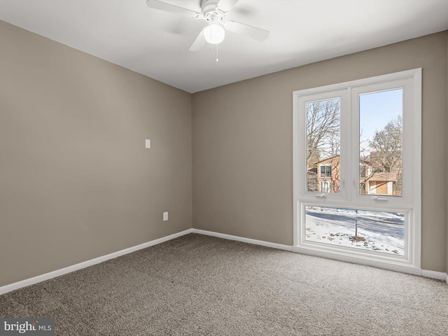 carpeted empty room with ceiling fan