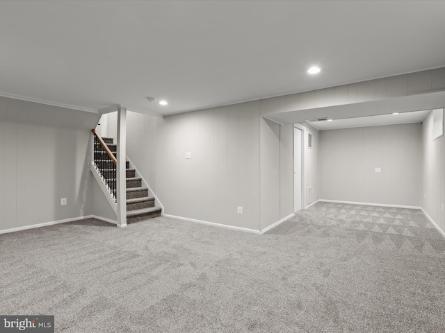 basement featuring light carpet