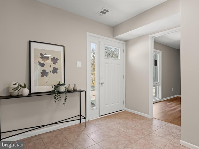 entryway featuring light tile patterned floors